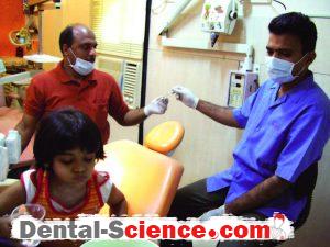 Transfer of needle syringe while the child rinsing her mouth